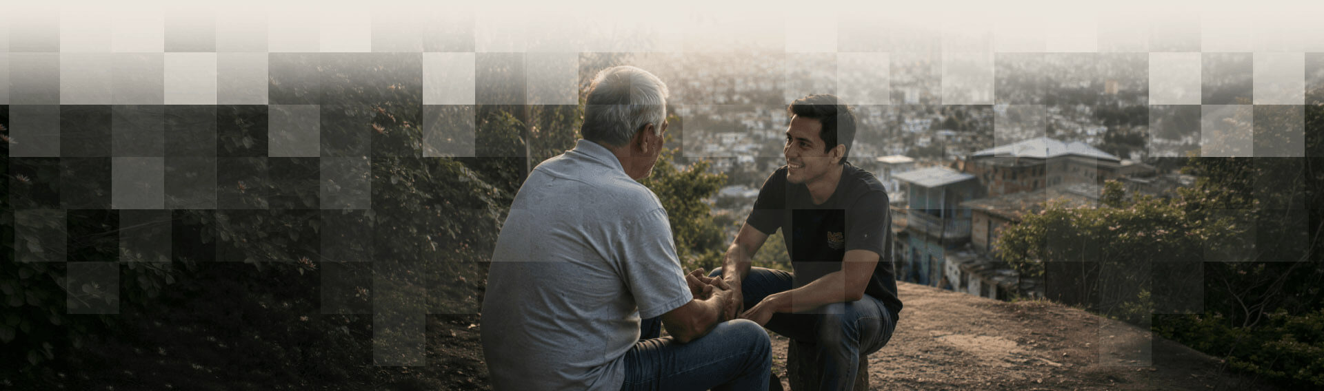 Two missionaries in conversation overlooking a city