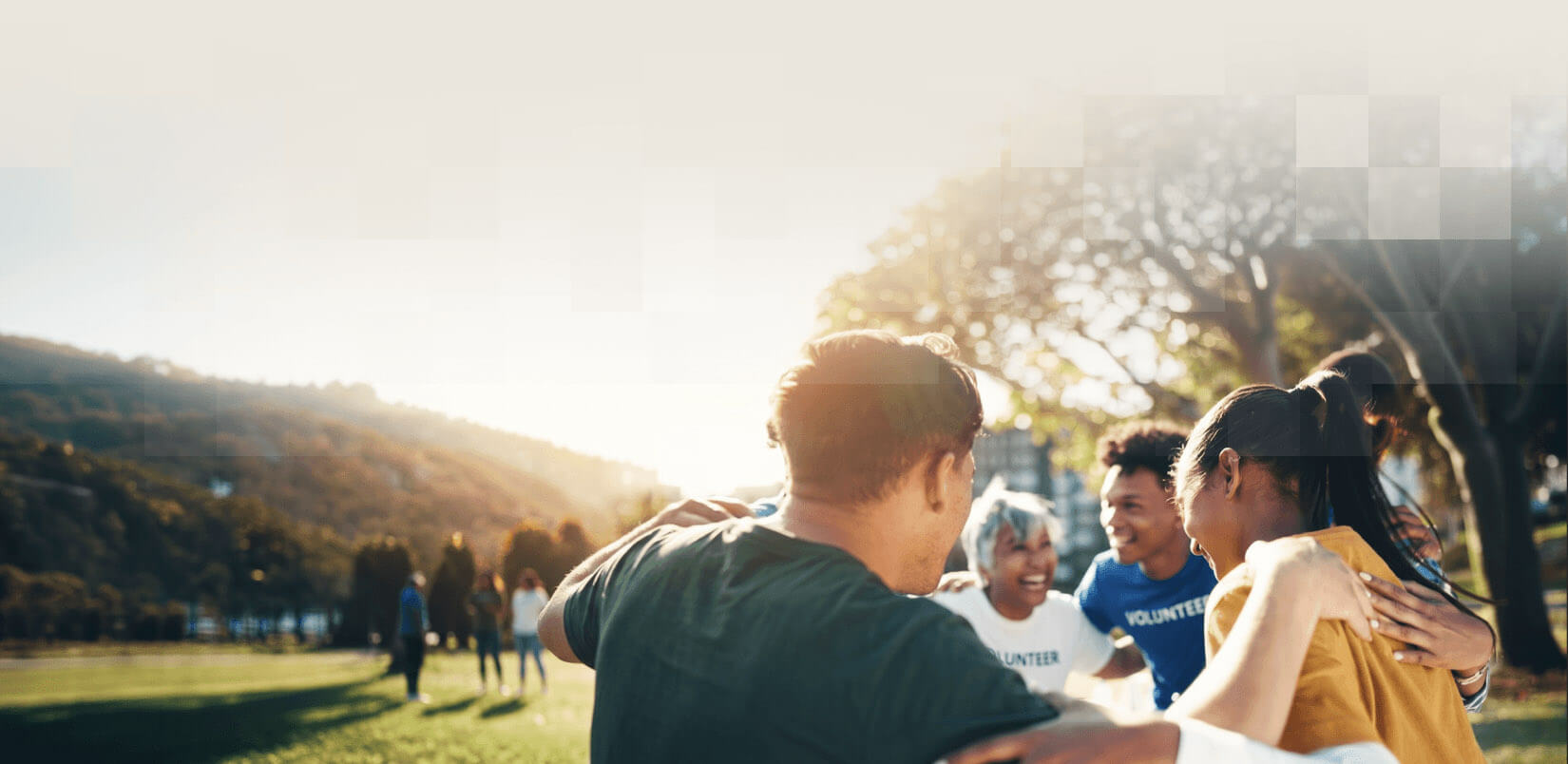 Volunteers in a group huddle